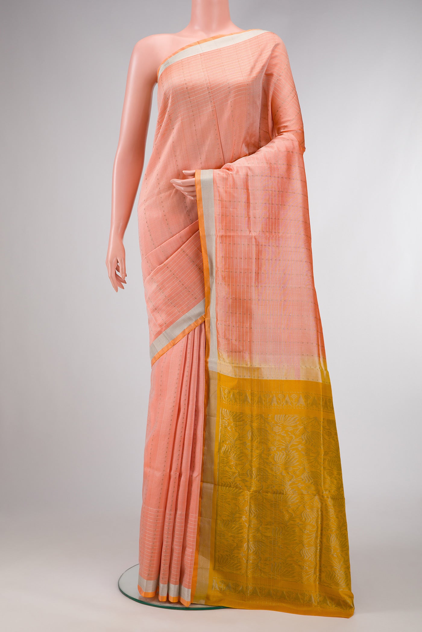 Peach Dual Tone Uppada Silk Saree with Stripes on the body and Zari Border.  displayed on a mannequin