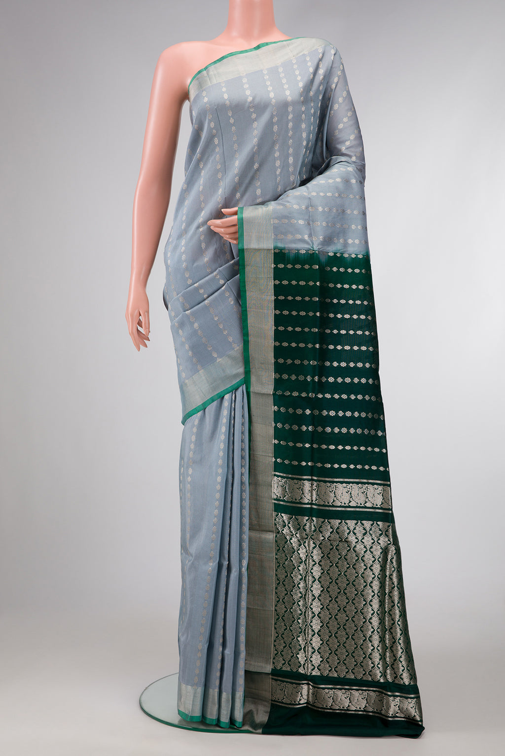 Grey Dual Tone Uppada Silk Saree with Stripes on the body and Zari Border.  displayed on a mannequin