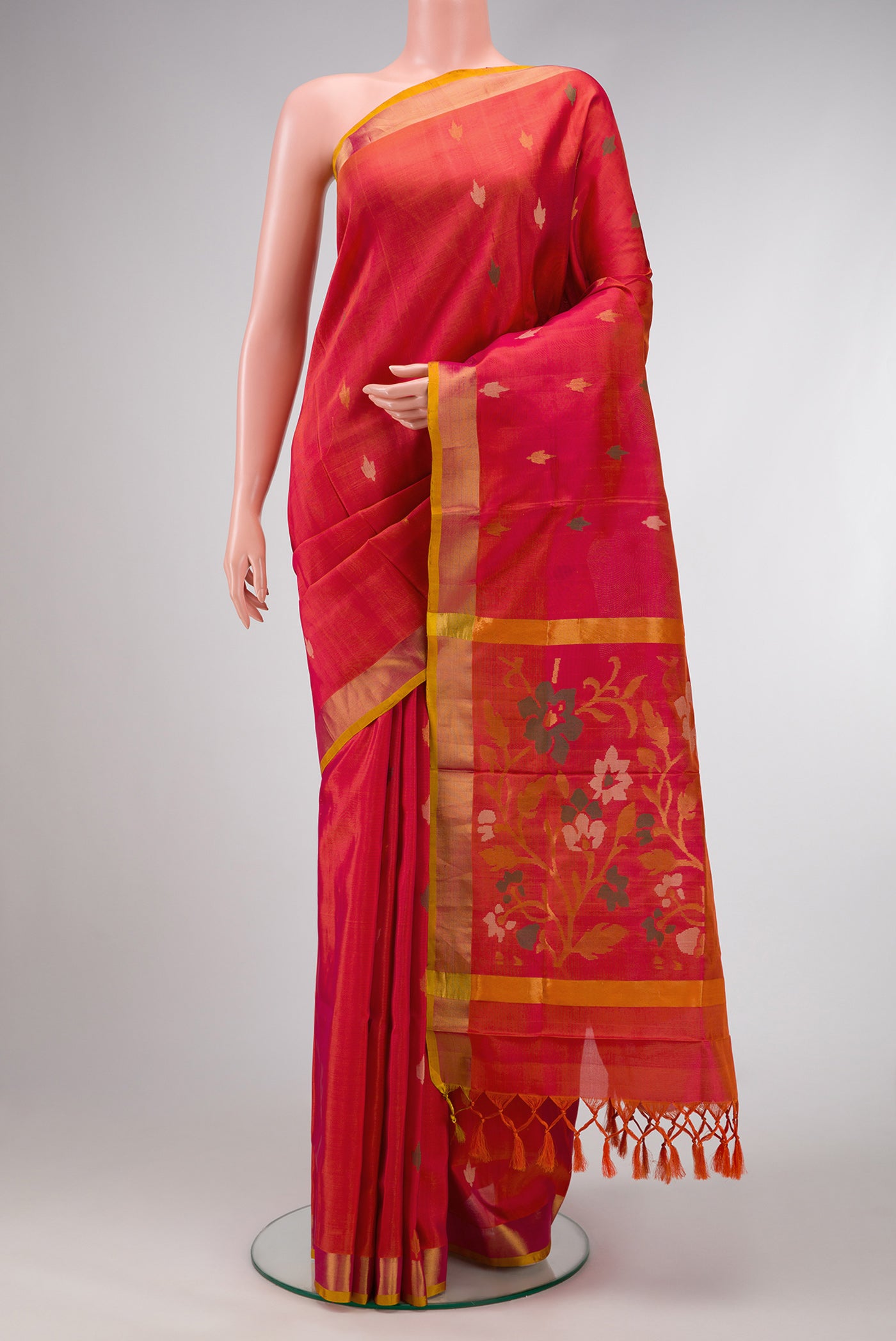 Coral Dual Tone Uppada Silk Saree with Zari And Thread Butta on the body and Zari Border.  displayed on a mannequin