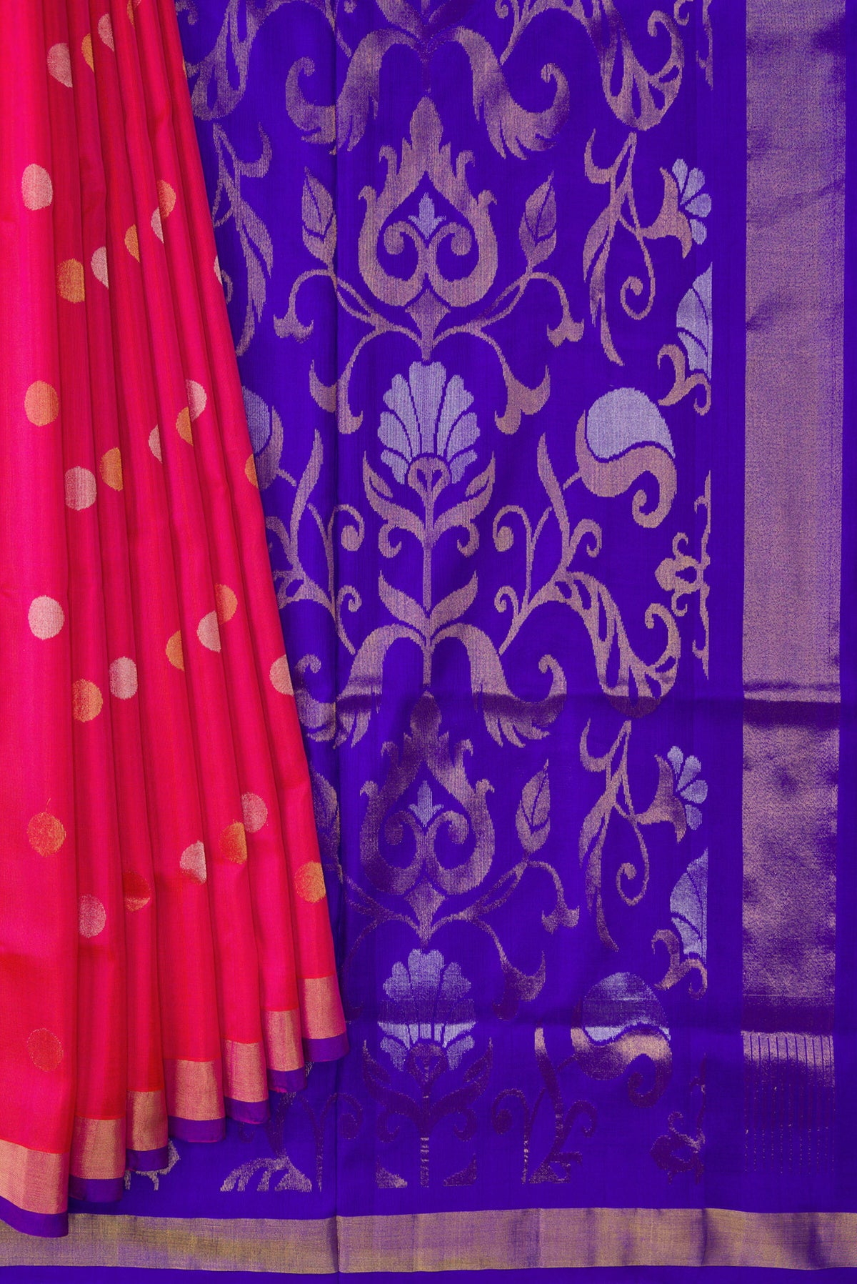Pleats and pallu of Dark Pink Dual Tone Uppada Silk Saree with Zari Butta on the body and Zari Border. 