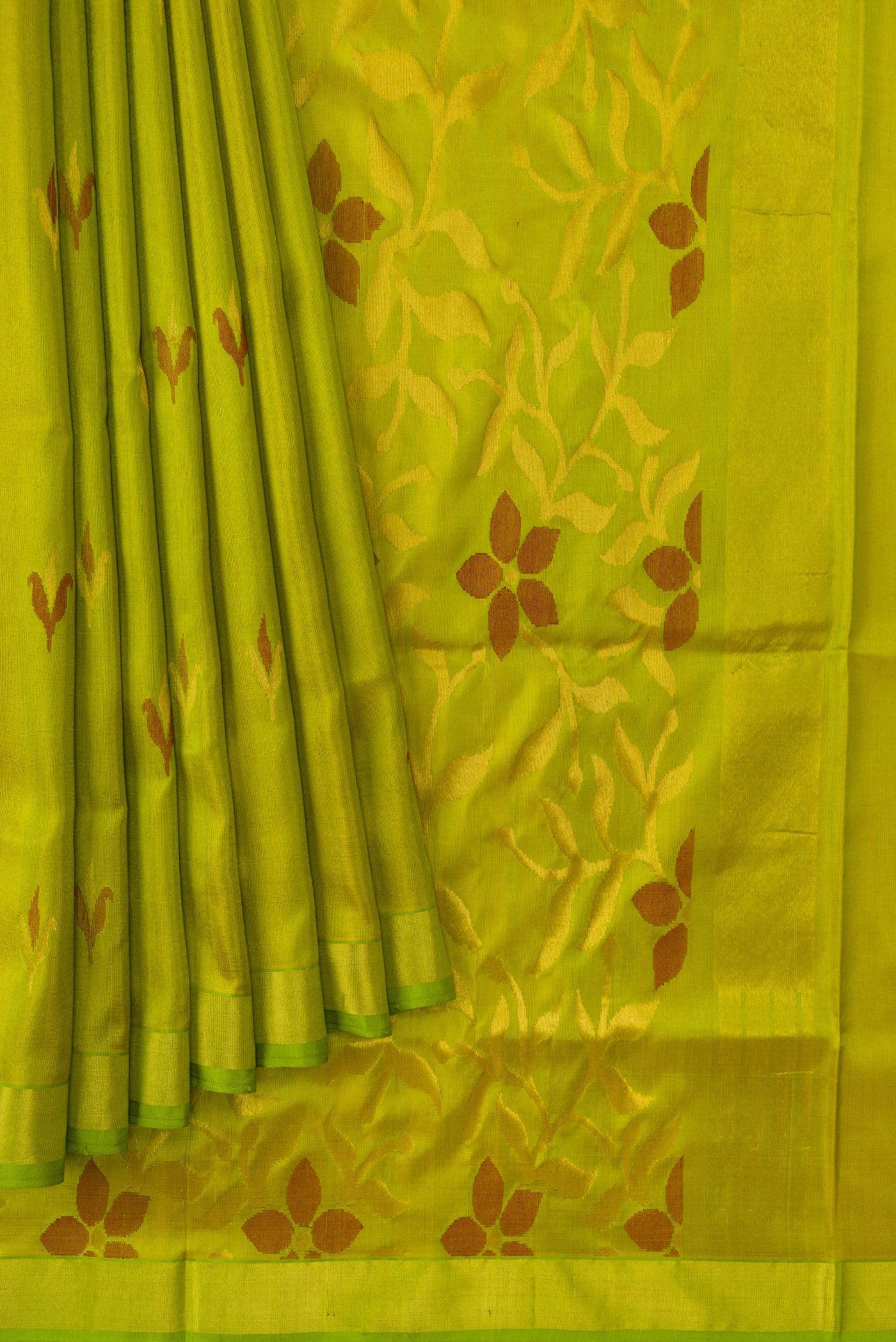 Pleats and pallu of Parrot Green Dual Tone Uppada Silk Saree with Zari And Thread Butta on the body and Zari Border. 