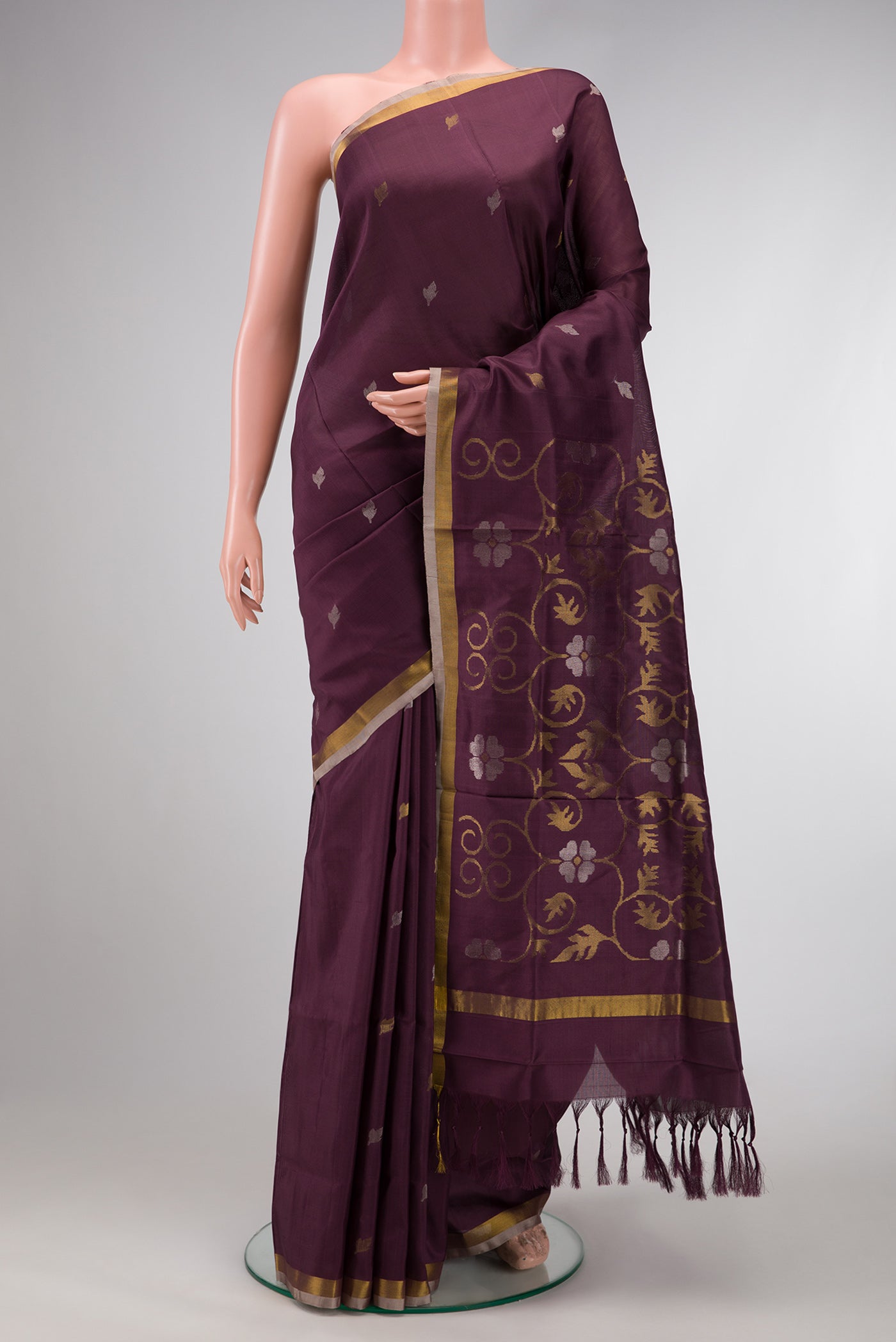 Brown Dual Tone Uppada Silk Saree with Zari Butta on the body and Zari Border.  displayed on a mannequin
