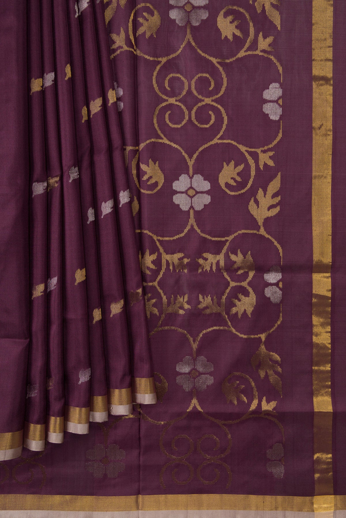 Pleats and pallu of Brown Dual Tone Uppada Silk Saree with Zari Butta on the body and Zari Border. 
