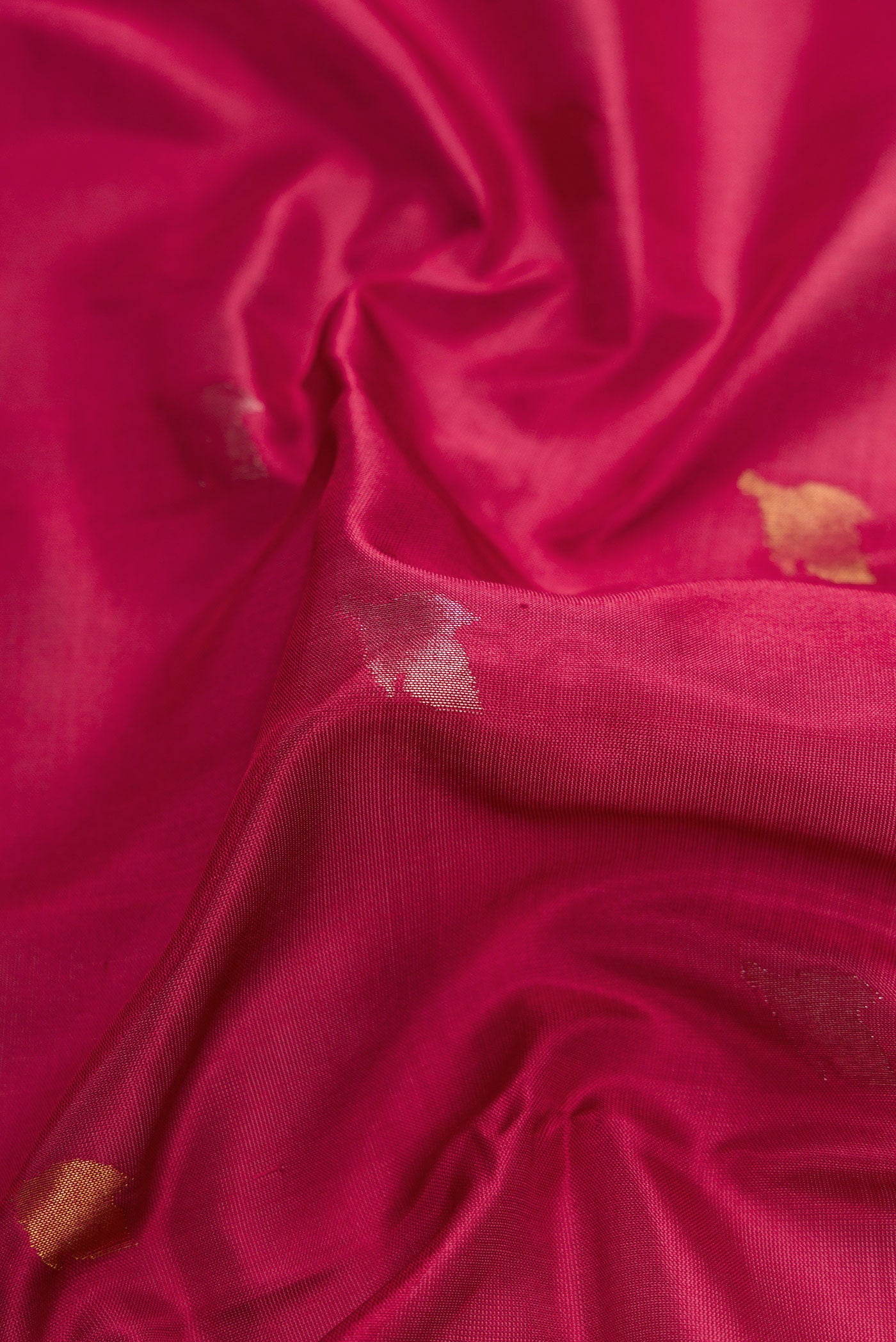 Close up of Dark Mauve Dual Tone Uppada Silk Saree with Zari Butta on the body and Zari Border.  displaying folds