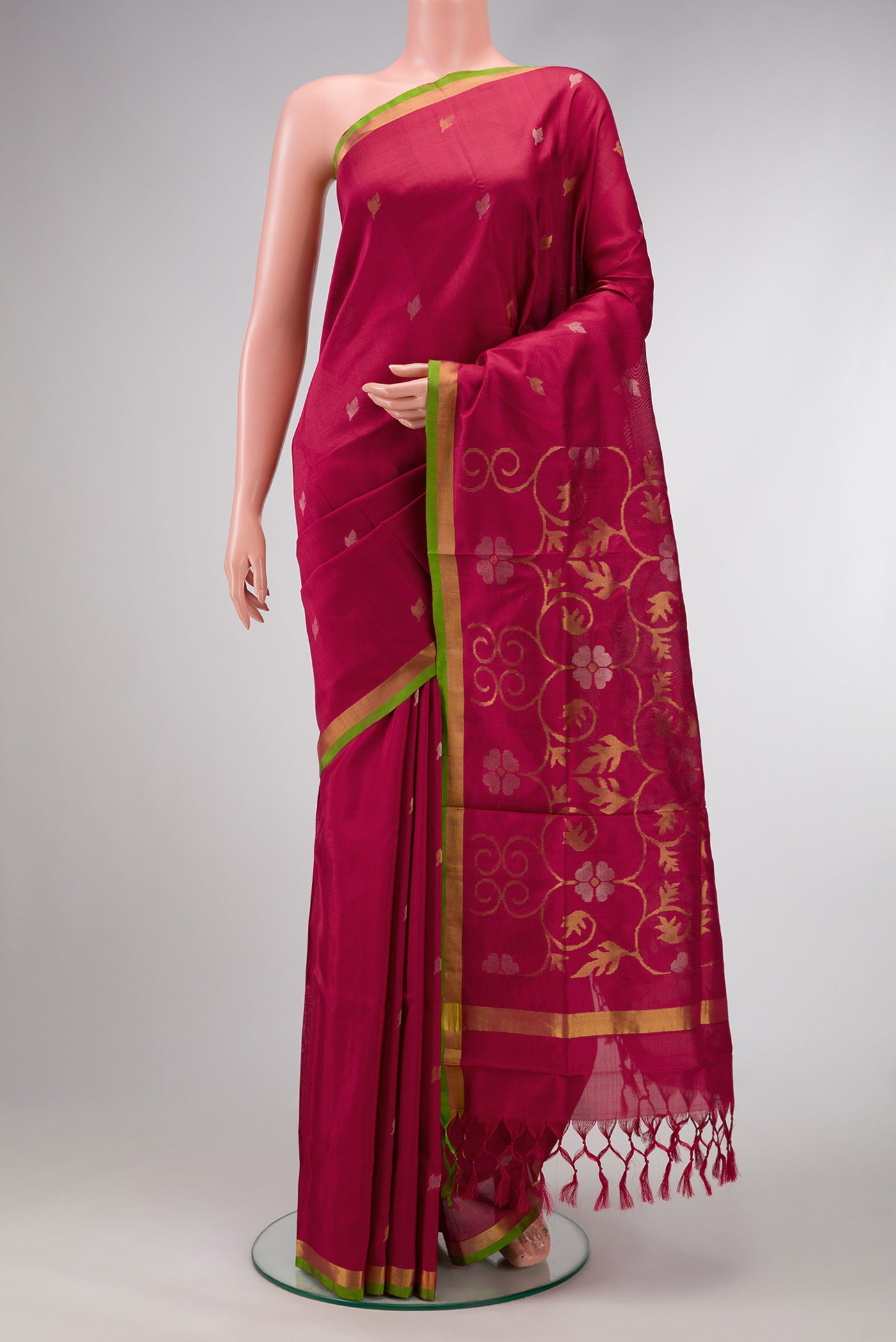 Dark Mauve Dual Tone Uppada Silk Saree with Zari Butta on the body and Zari Border.  displayed on a mannequin