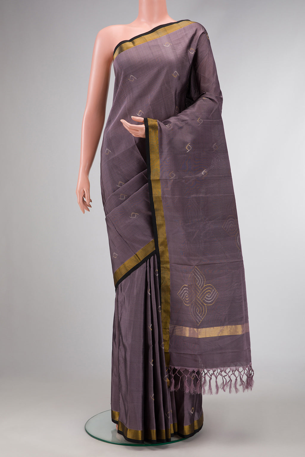 Lavender Dual Tone Soft Silk Saree with Zari Butta on the body and Zari Border.  displayed on a mannequin