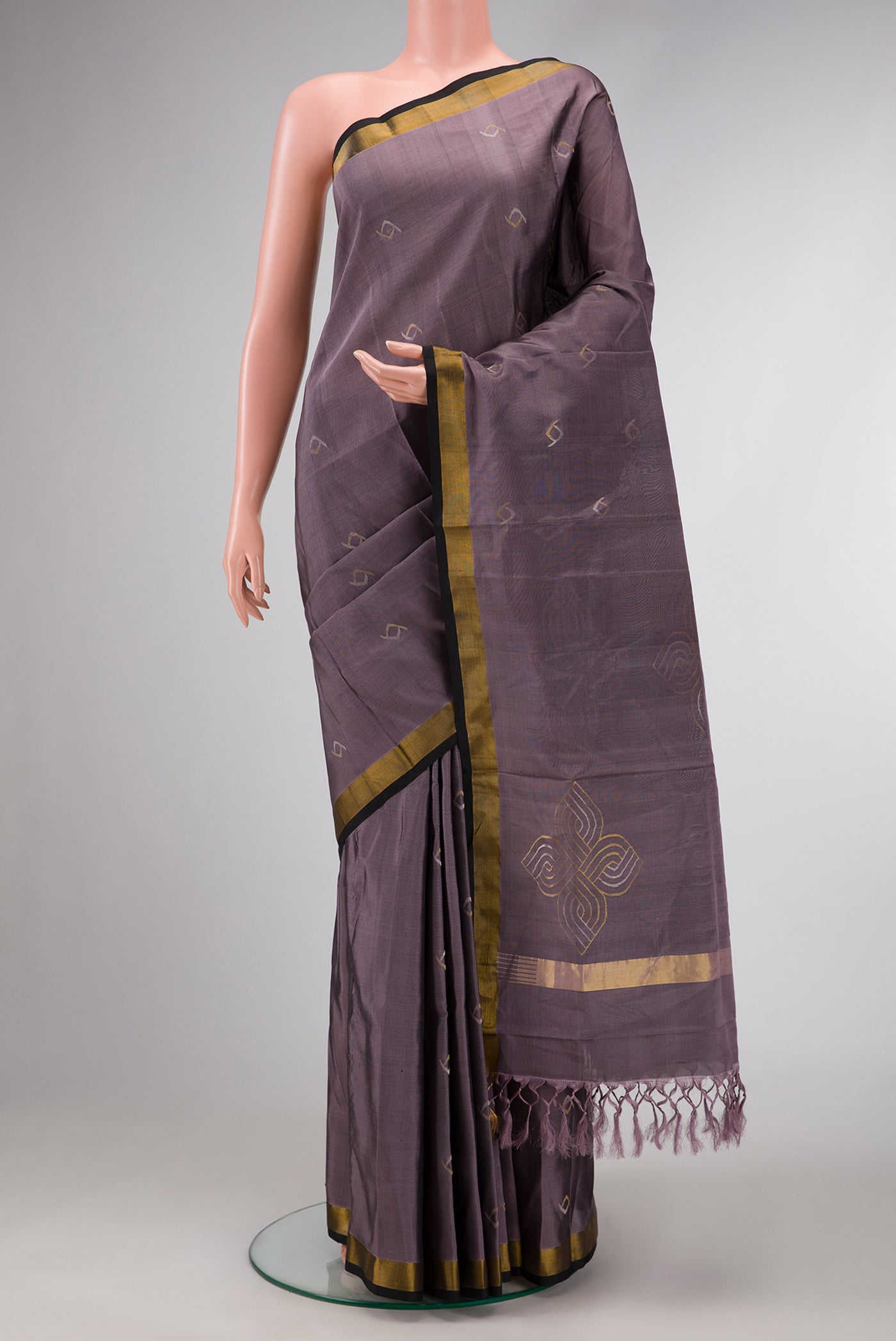Lavender Dual Tone Soft Silk Saree with Zari Butta on the body and Zari Border.  displayed on a mannequin