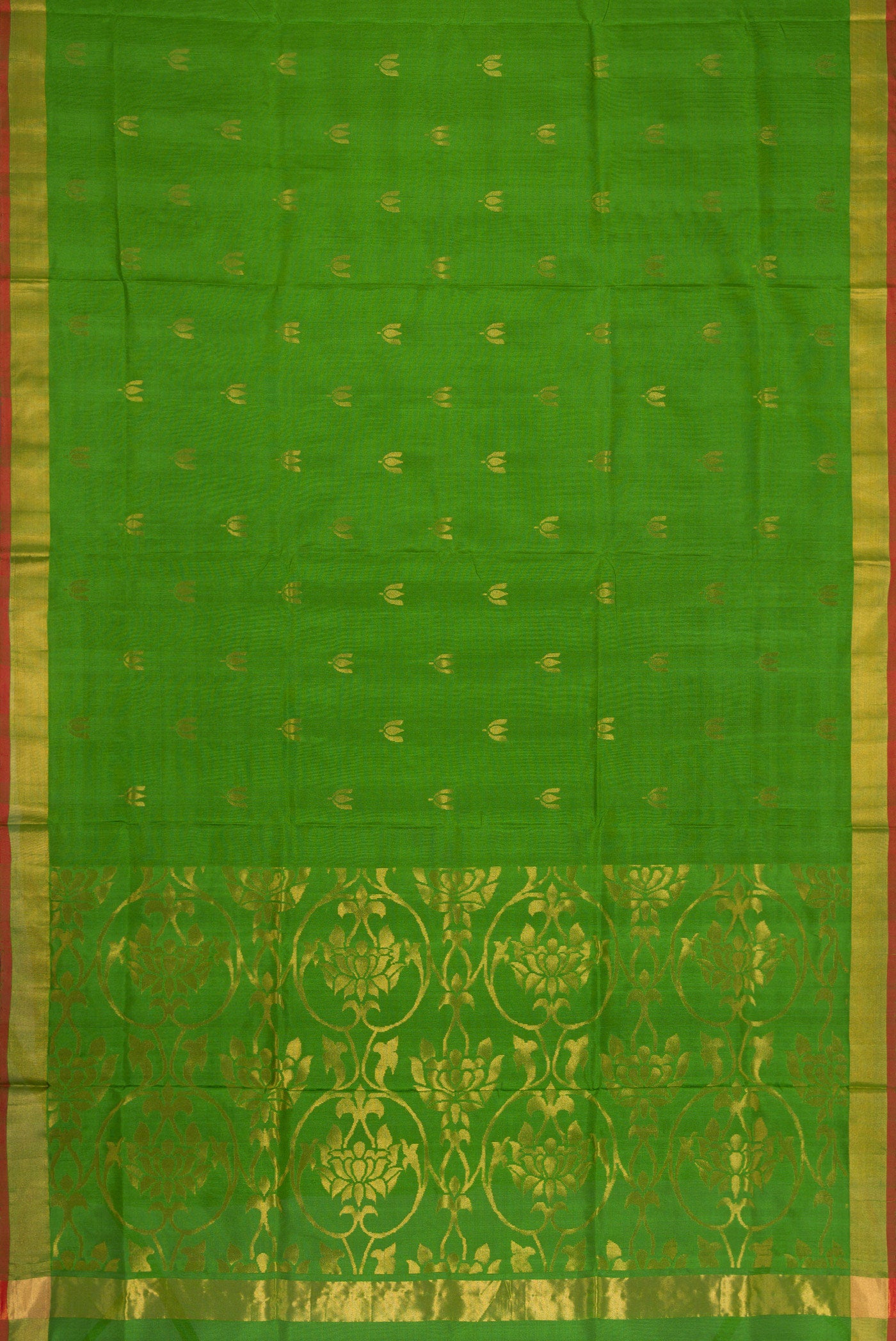 Flat view of Green Dual Tone Soft Silk Saree with Zari Butta on the body and Zari Border. 