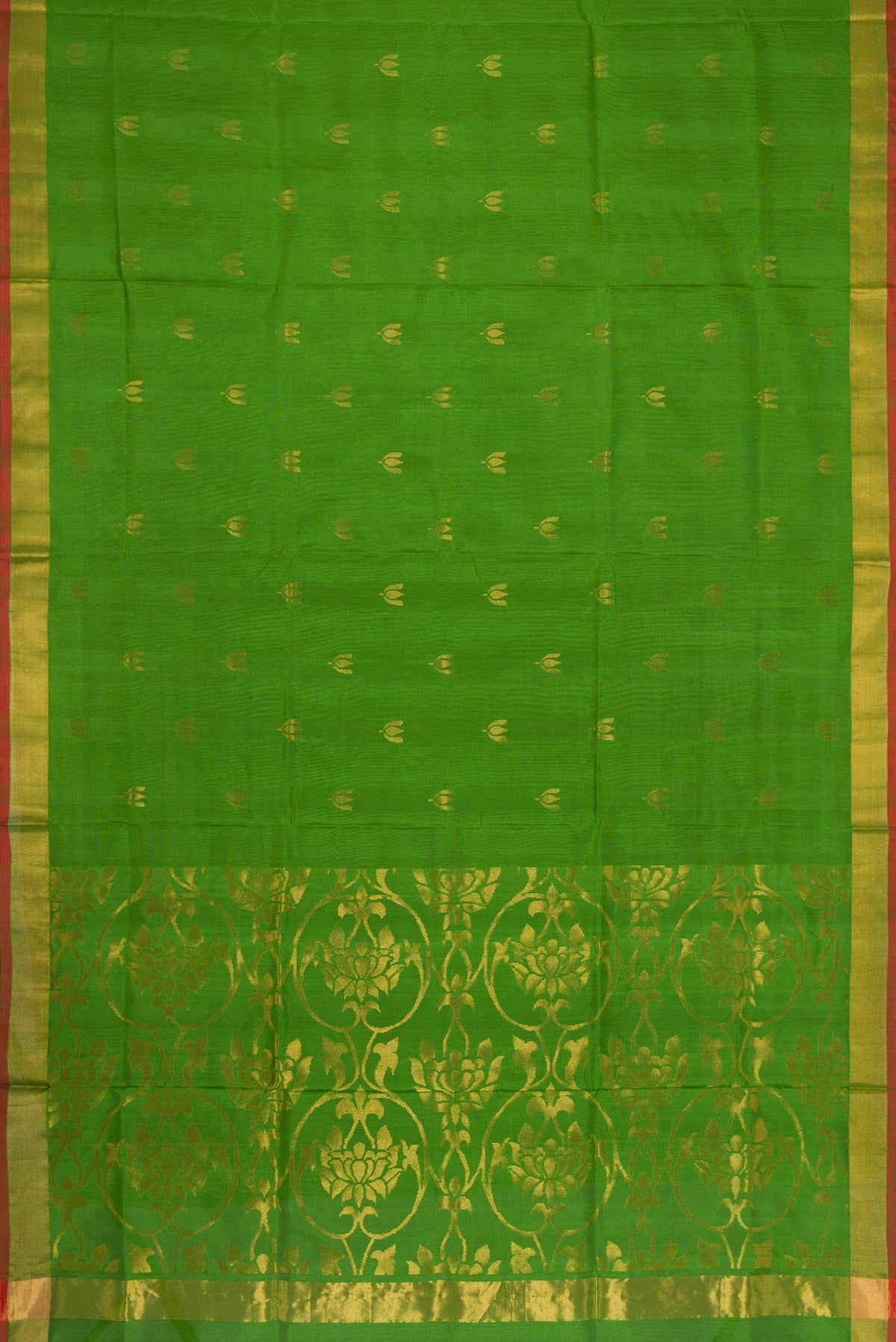 Flat view of Green Dual Tone Soft Silk Saree with Zari Butta on the body and Zari Border. 