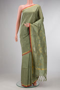 Light Green Dual Tone Soft Silk Saree with Zari Butta on the body and Zari Border.  displayed on a mannequin