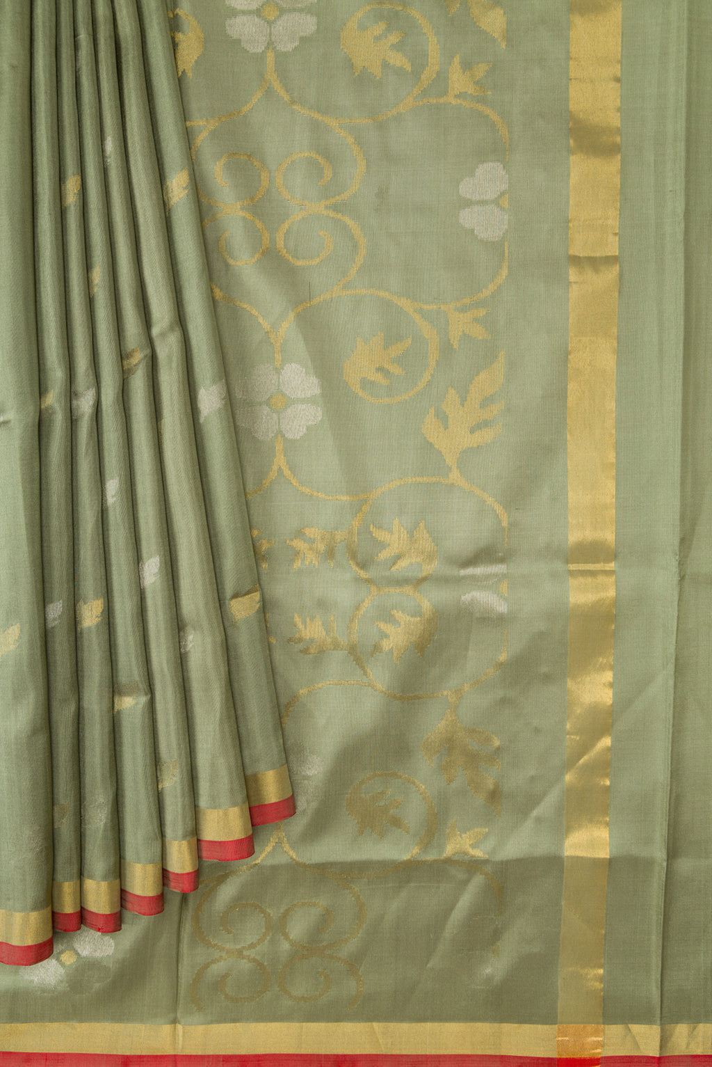 Pleats and pallu of Light Green Dual Tone Soft Silk Saree with Zari Butta on the body and Zari Border. 