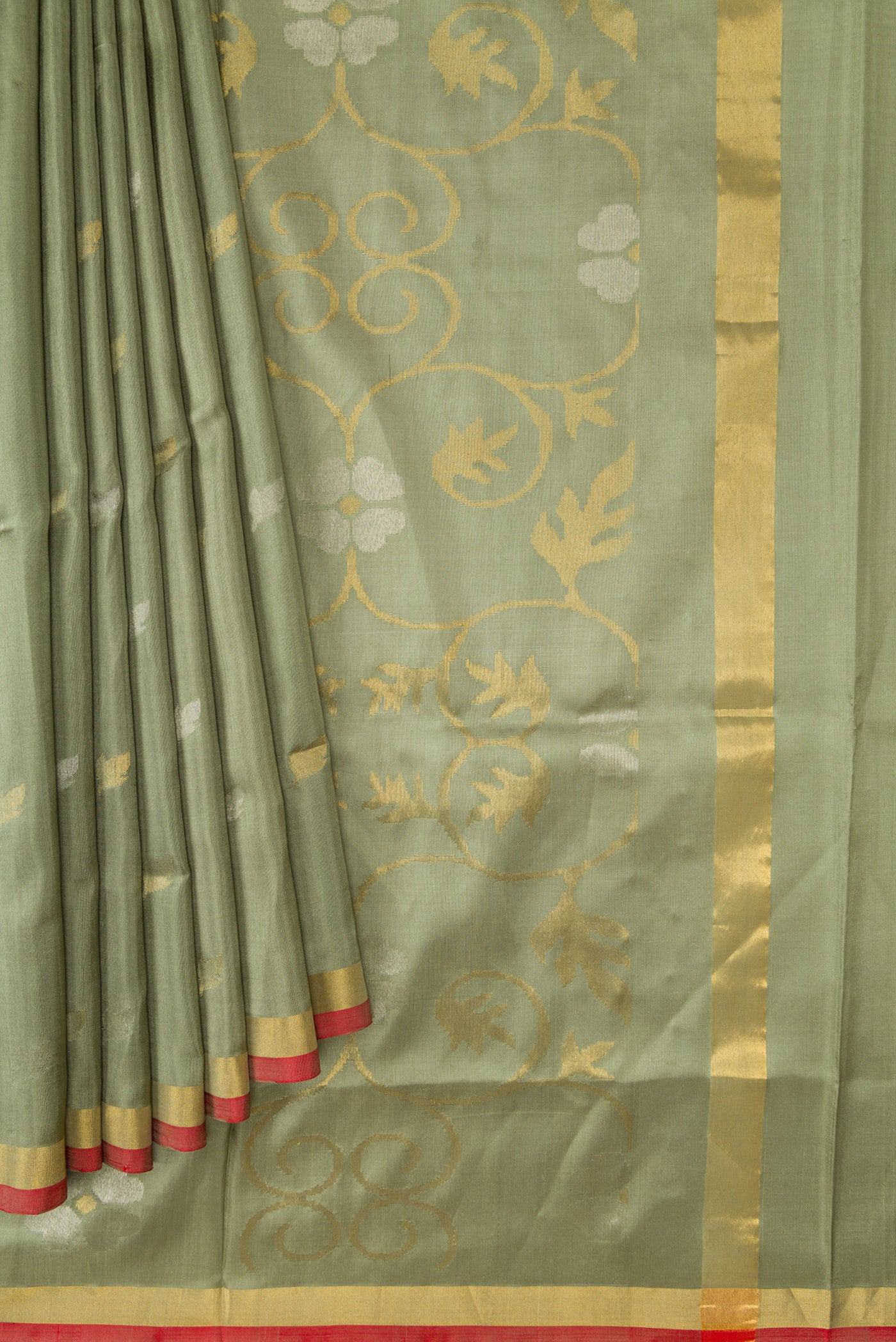 Pleats and pallu of Light Green Dual Tone Soft Silk Saree with Zari Butta on the body and Zari Border. 