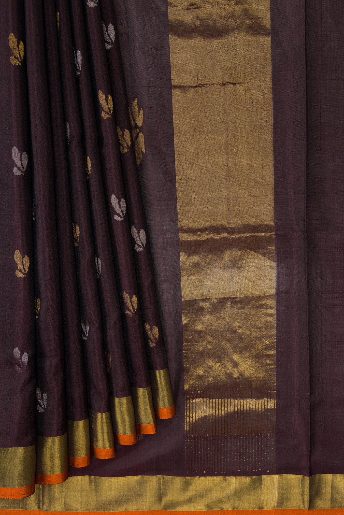 Pleats and pallu of Coffee Brown Dual Tone Soft Silk Saree with Zari Butta on the body and Zari Border. 