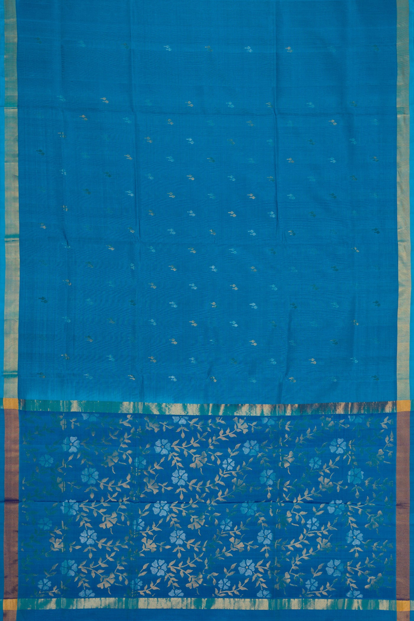 Flat view of Sky Blue Dual Tone Soft Silk Saree with Zari Butta on the body and Zari Border. 