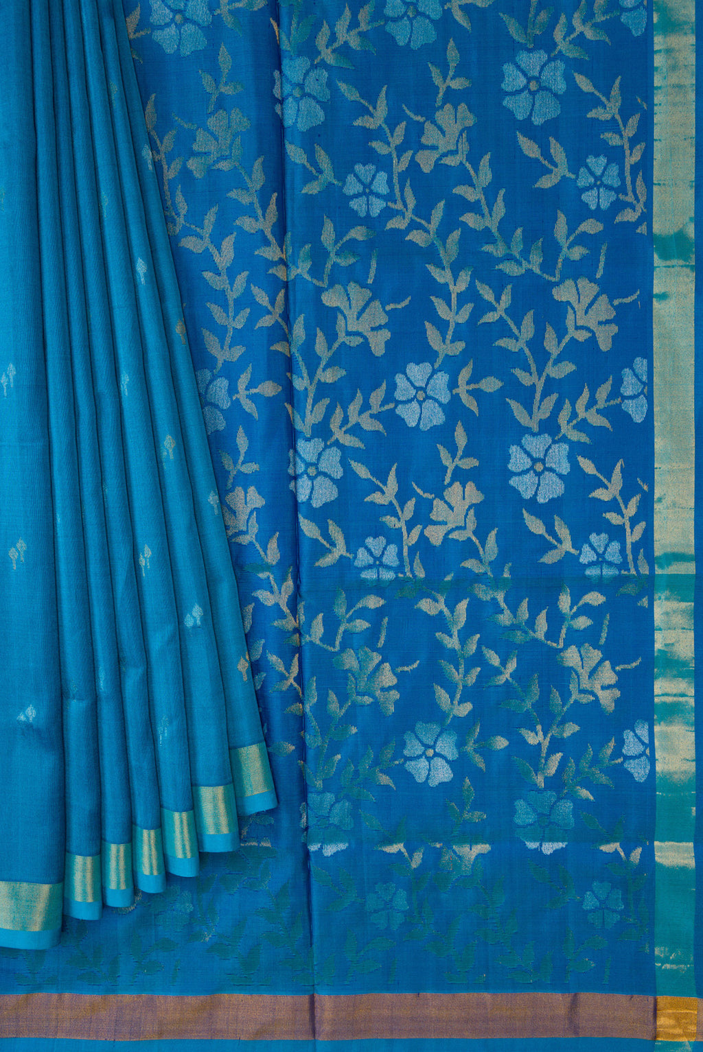 Pleats and pallu of Sky Blue Dual Tone Soft Silk Saree with Zari Butta on the body and Zari Border. 