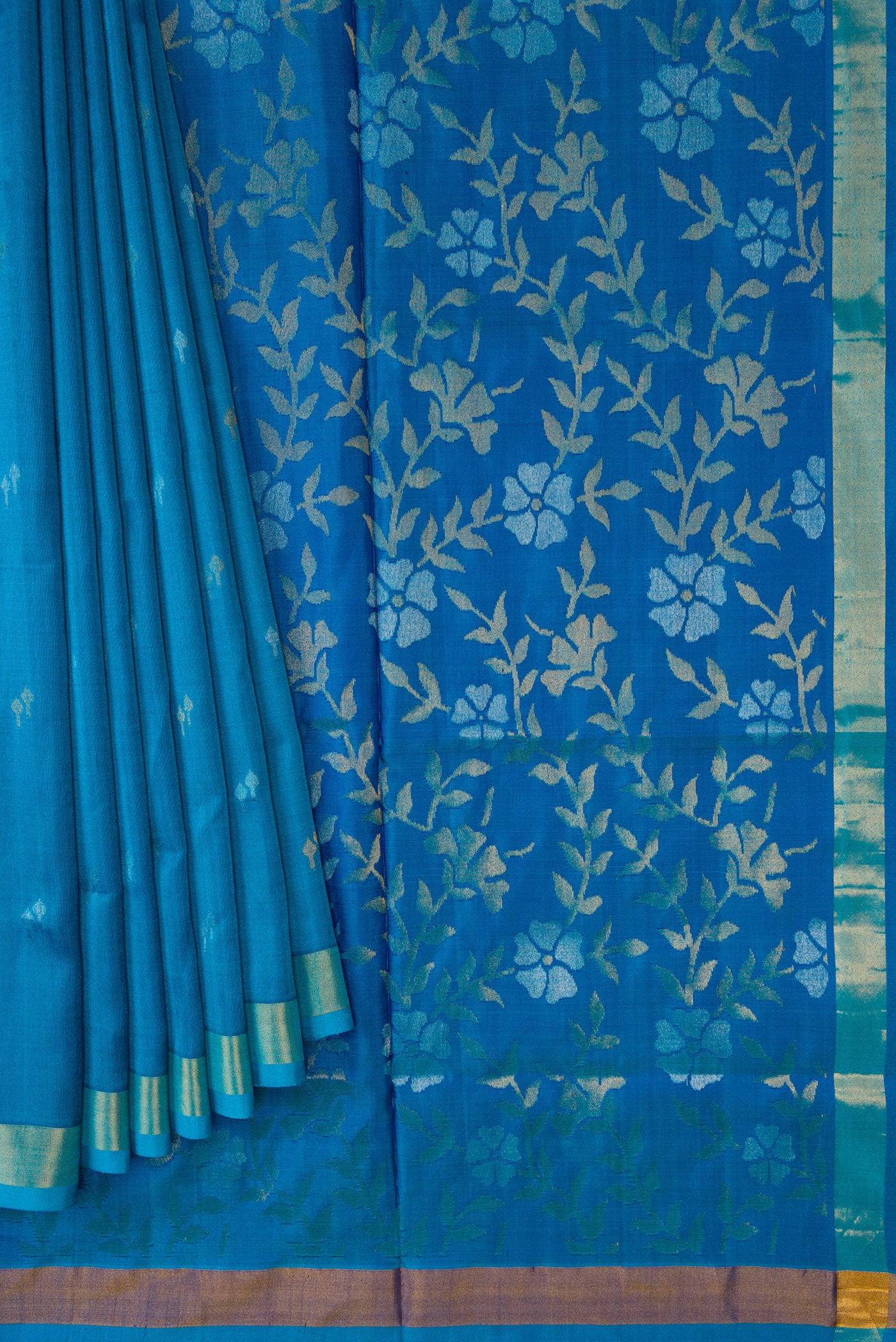 Pleats and pallu of Sky Blue Dual Tone Soft Silk Saree with Zari Butta on the body and Zari Border. 