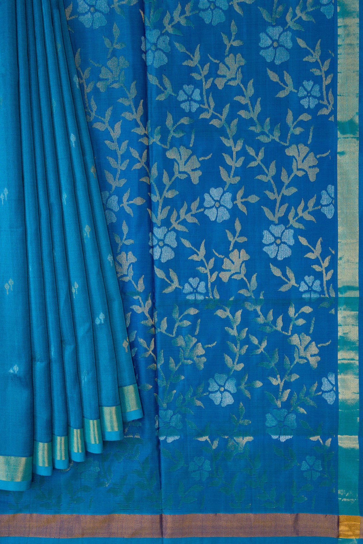 Pleats and pallu of Sky Blue Dual Tone Soft Silk Saree with Zari Butta on the body and Zari Border. 
