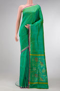 Green Dual Tone Uppada Silk Saree with Zari Butta on the body and Zari Border.  displayed on a mannequin