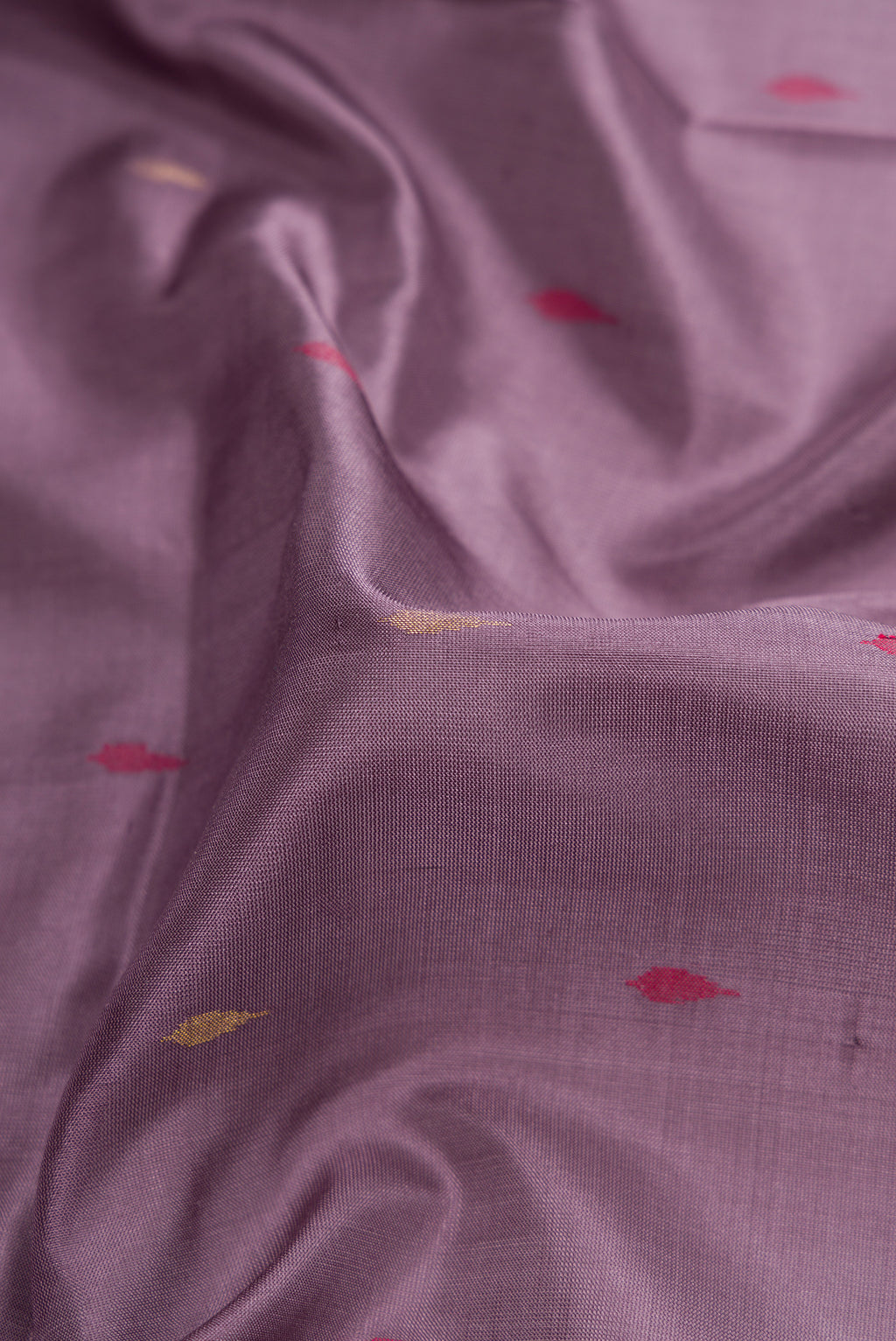 Close up of Purple Dual Tone Uppada Silk Saree with Zari And Thread Butta on the body and Zari Border.  displaying folds