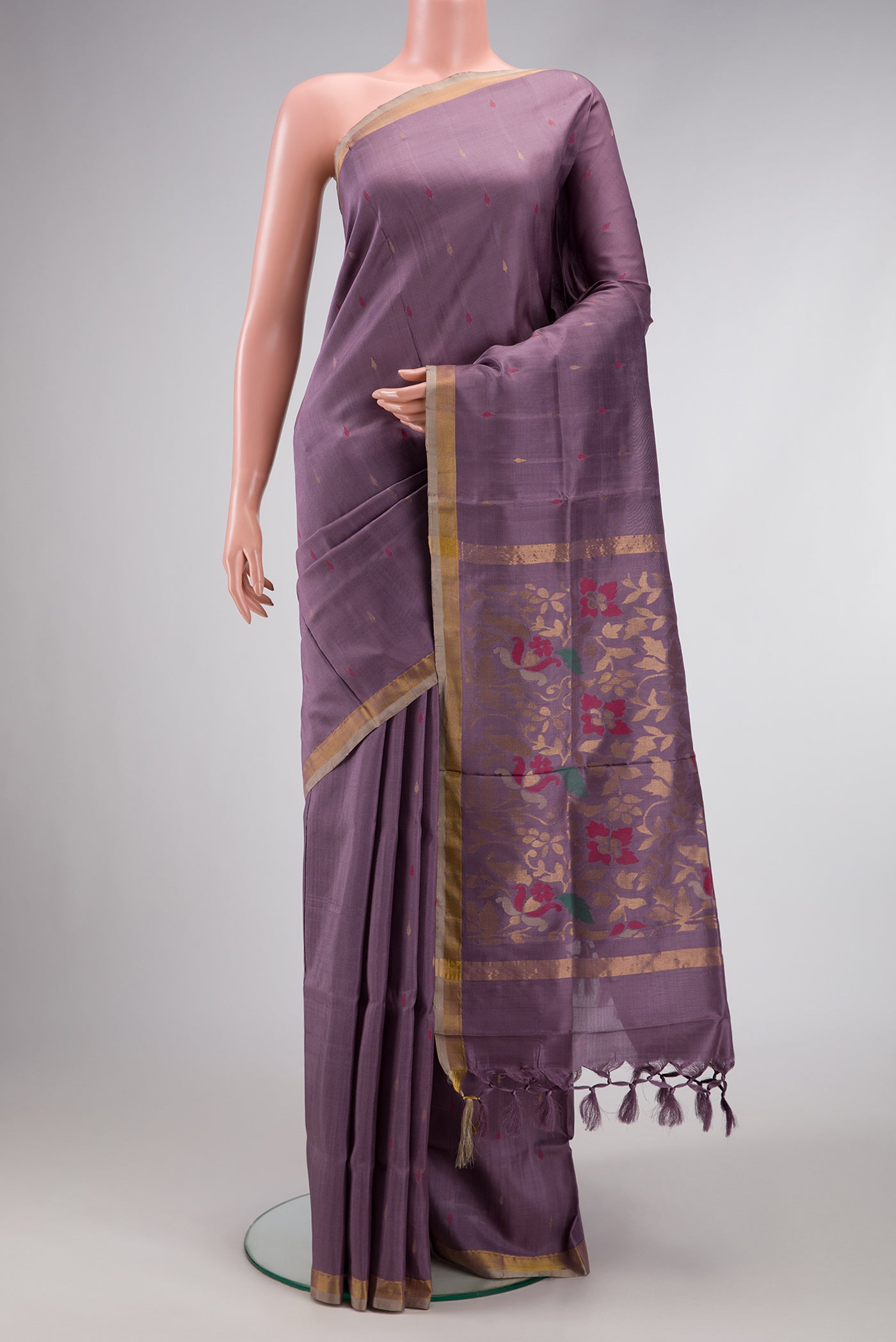 Purple Dual Tone Uppada Silk Saree with Zari And Thread Butta on the body and Zari Border.  displayed on a mannequin