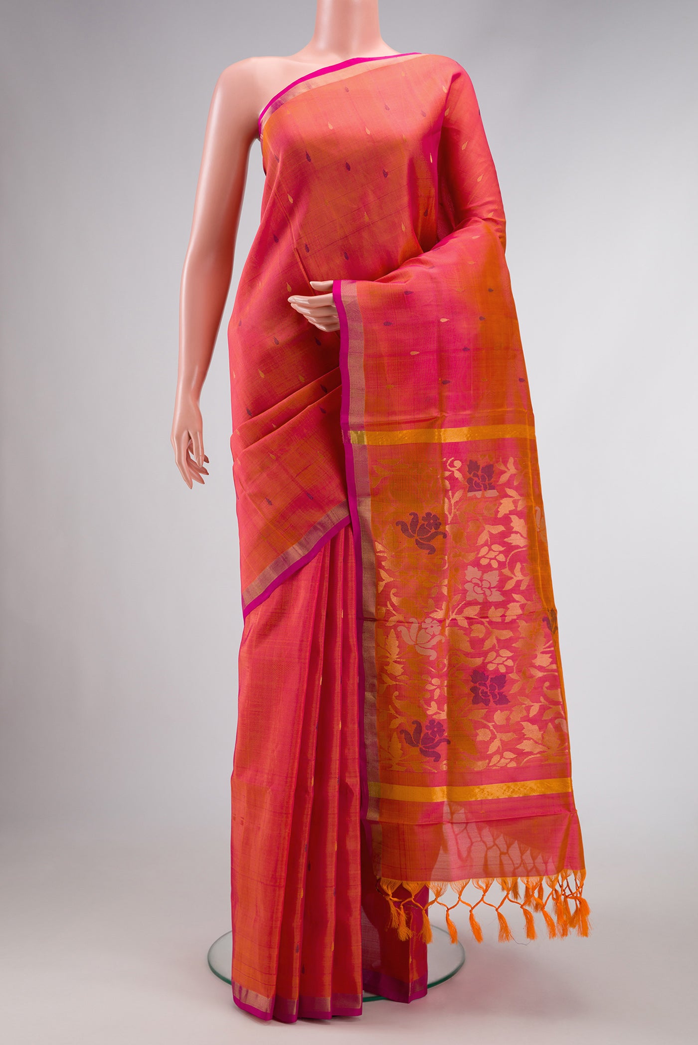 Coral Dual Tone Uppada Silk Saree with Zari And Thread Butta on the body and Zari Border.  displayed on a mannequin