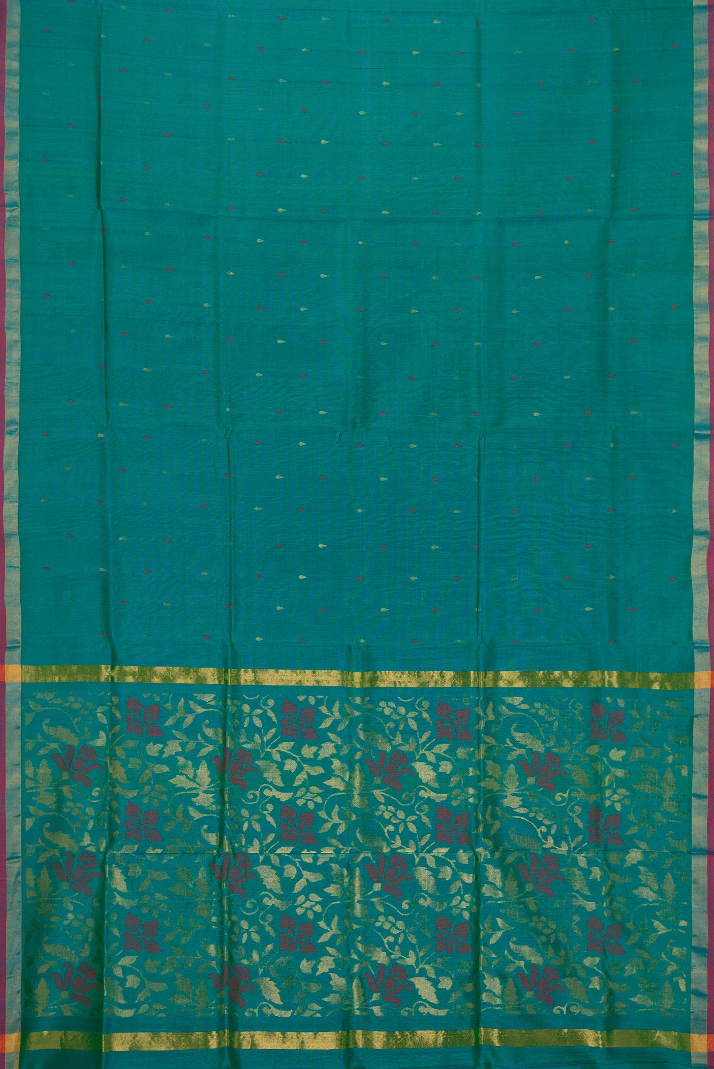 Flat view of Peacock Blue Dual Tone Uppada Silk Saree with Zari And Thread Butta on the body and Zari Border. 