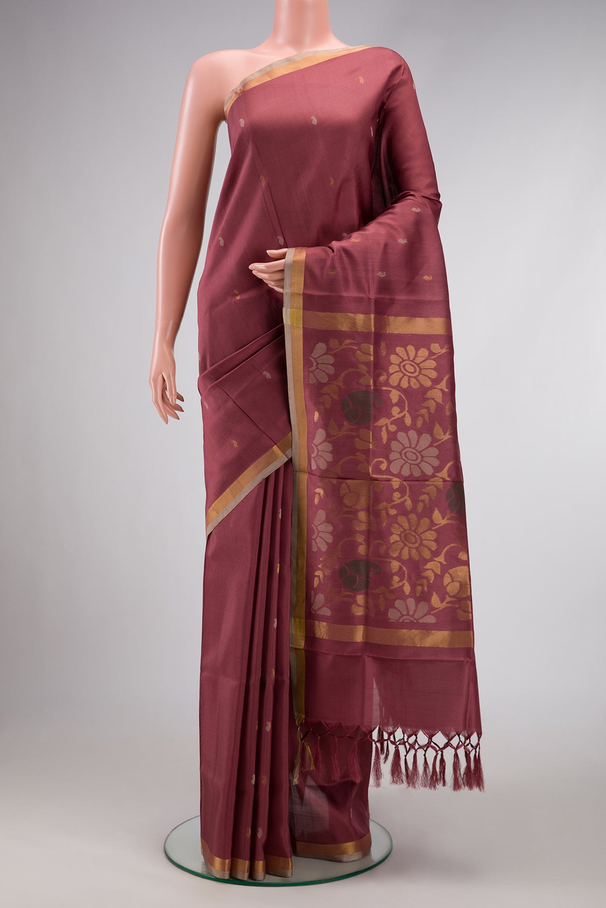 Brown Dual Tone Uppada Silk Saree with Zari Butta on the body and Zari Border.  displayed on a mannequin