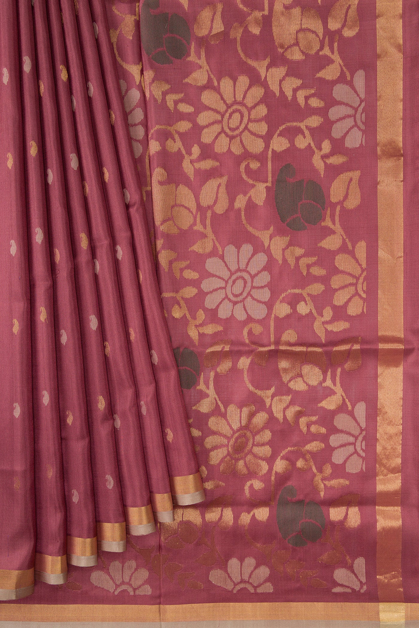 Pleats and pallu of Brown Dual Tone Uppada Silk Saree with Zari Butta on the body and Zari Border. 