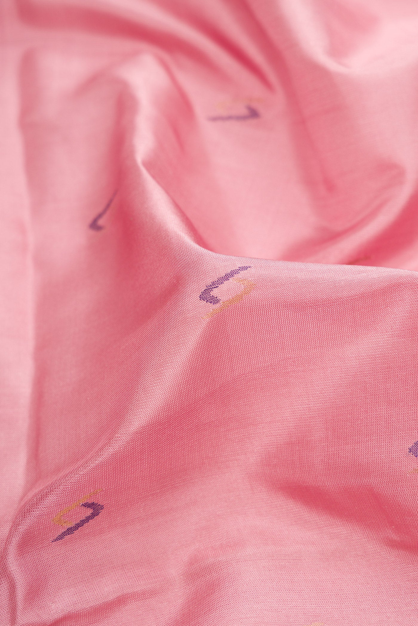 Close up of Pink Dual Tone Uppada Silk Saree with Zari And Thread Butta on the body and Zari Border.  displaying folds