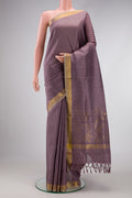 Lavender Dual Tone Uppada Silk Saree with Zari Butta on the body and Zari Border.  displayed on a mannequin