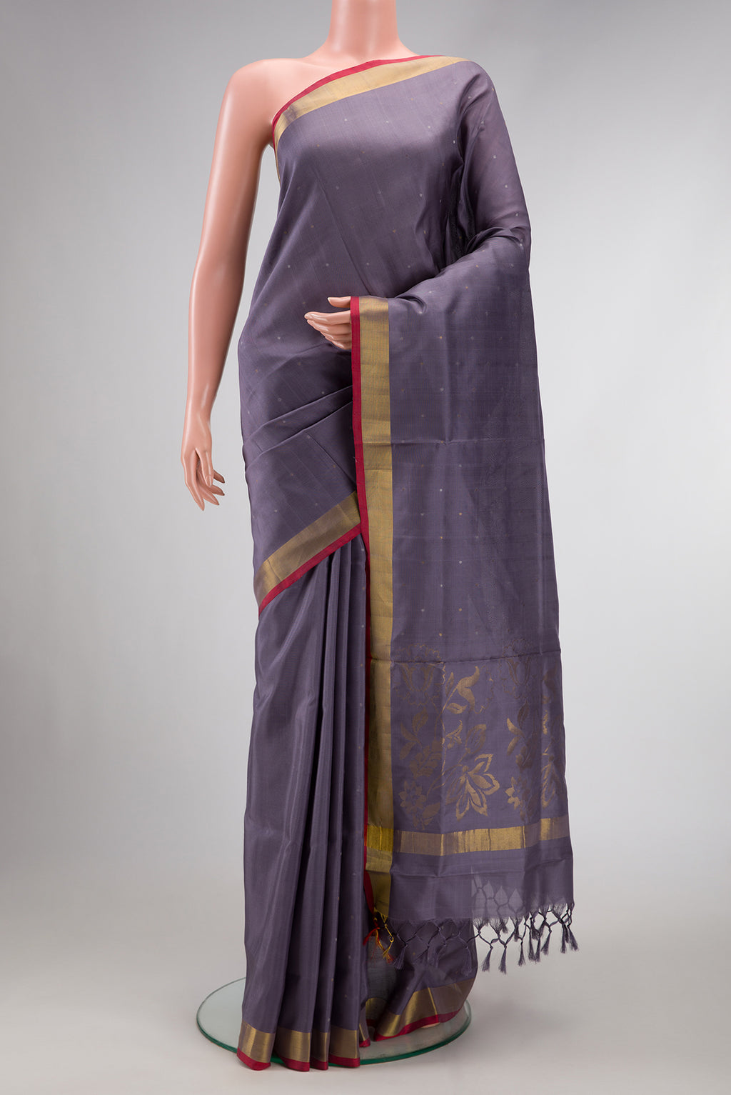 Grey Dual Tone Uppada Silk Saree with Zari Butta on the body and Zari Border.  displayed on a mannequin