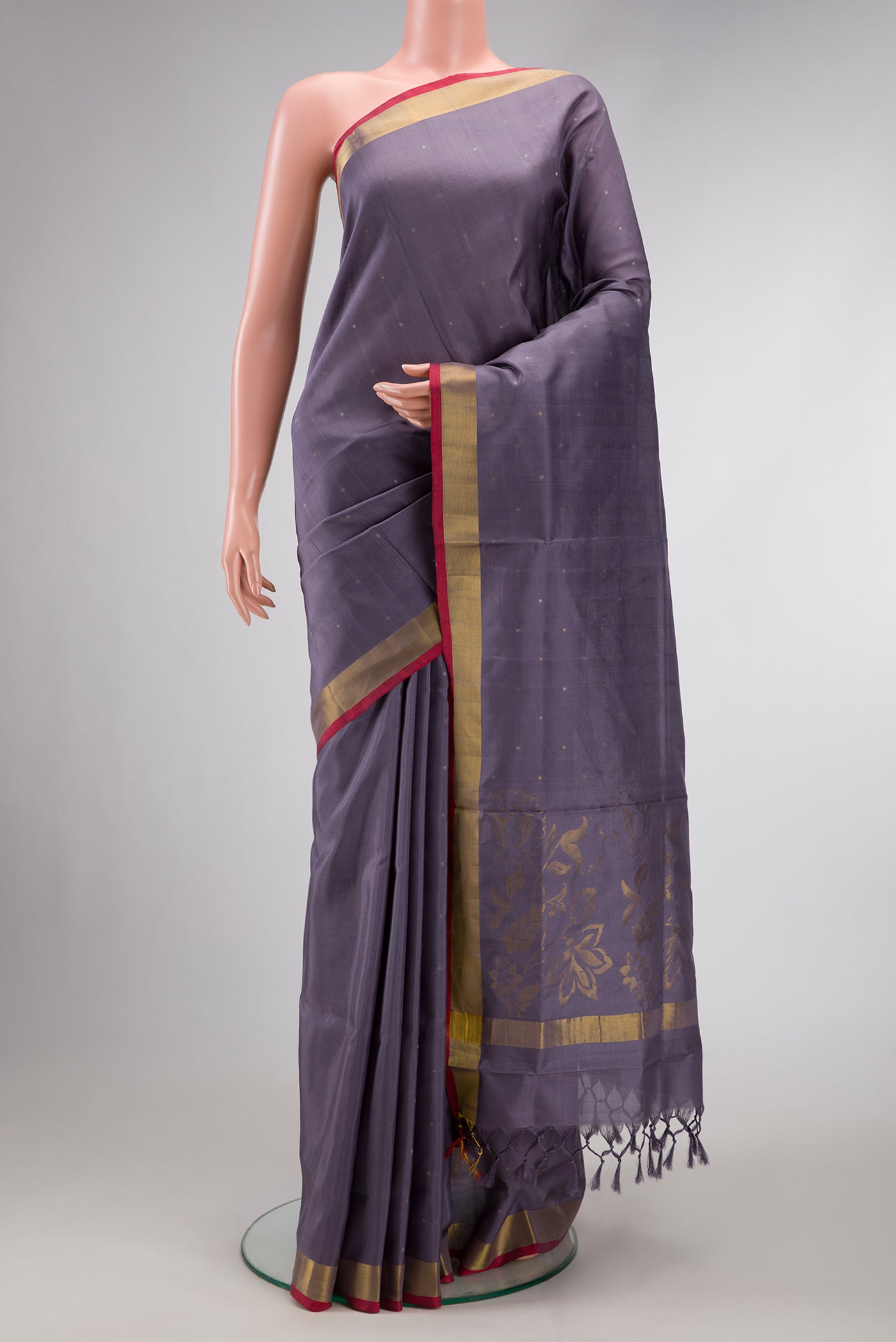 Grey Dual Tone Uppada Silk Saree with Zari Butta on the body and Zari Border.  displayed on a mannequin