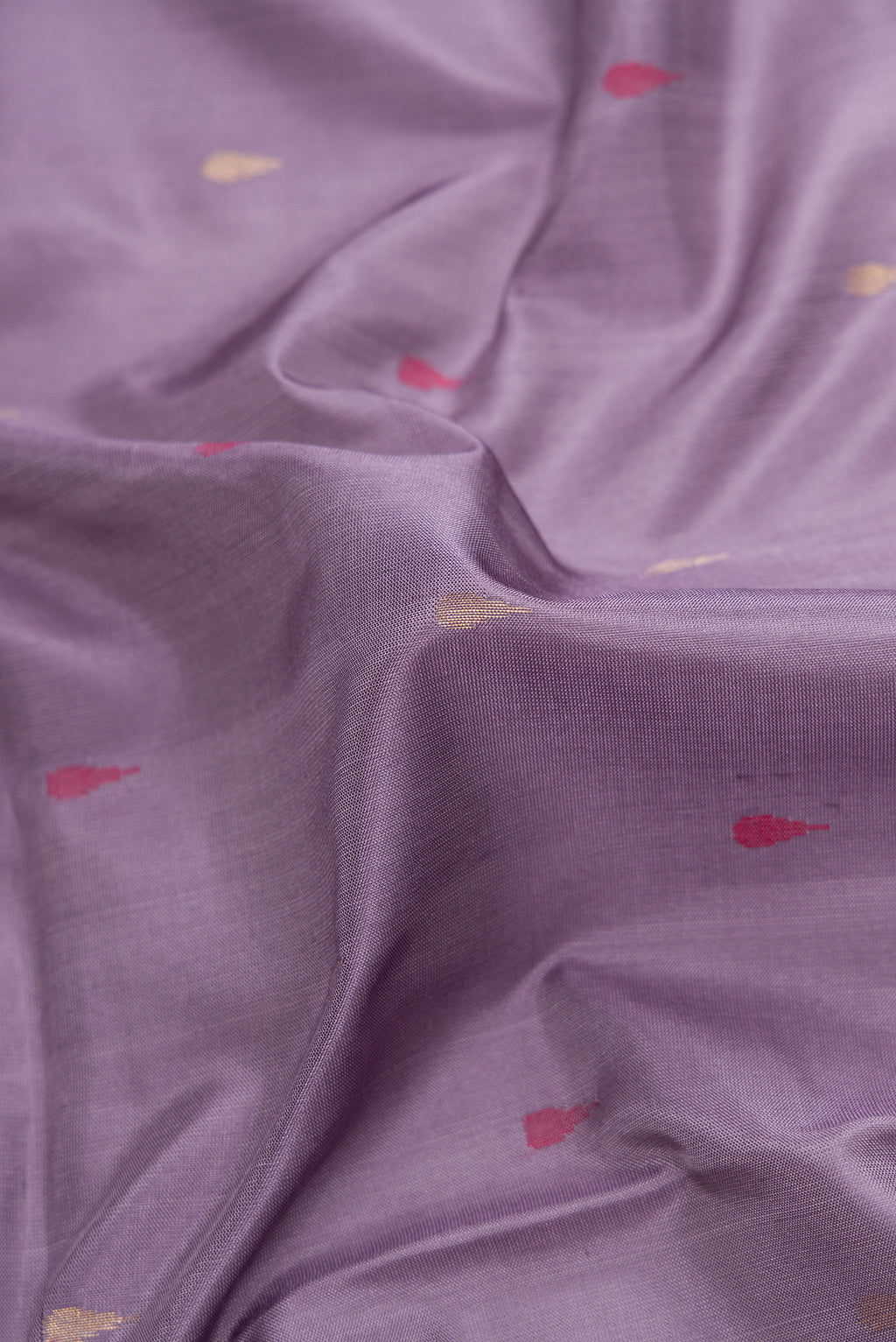 Close up of Purple Dual Tone Uppada Silk Saree with Zari And Thread Butta on the body and Zari Border.  displaying folds