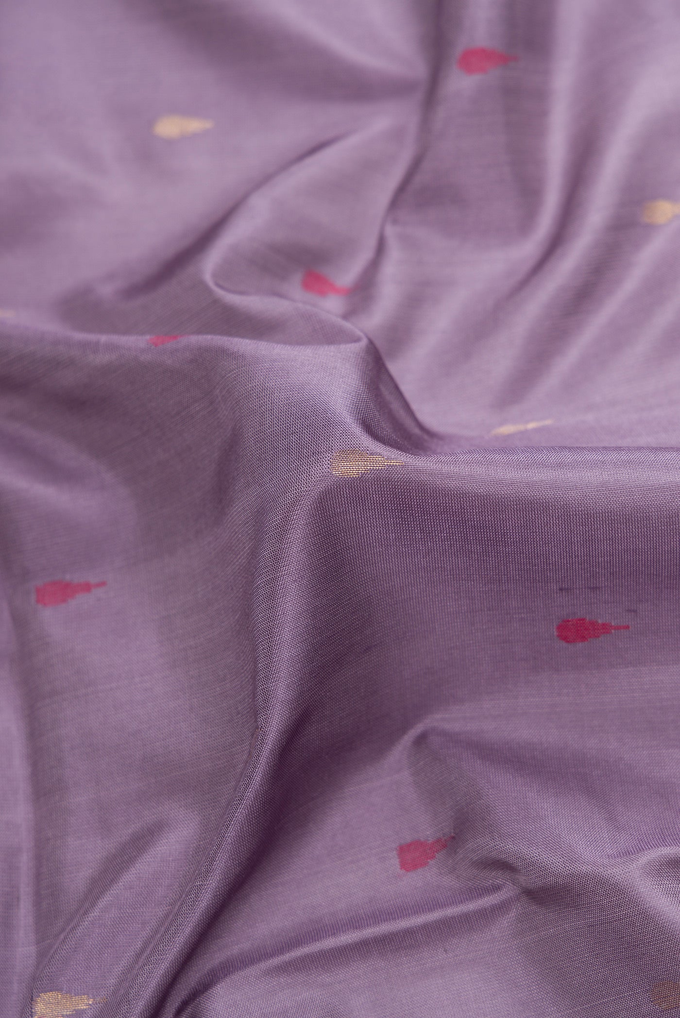 Close up of Purple Dual Tone Uppada Silk Saree with Zari And Thread Butta on the body and Zari Border.  displaying folds