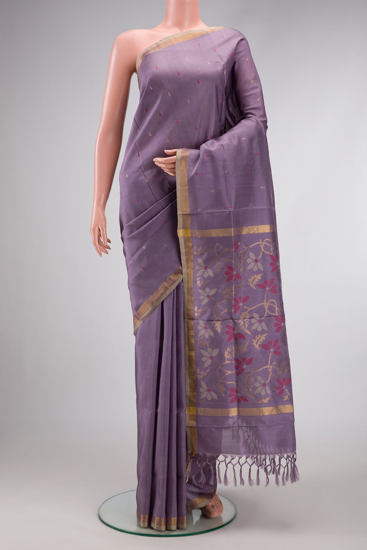 Purple Dual Tone Uppada Silk Saree with Zari And Thread Butta on the body and Zari Border.  displayed on a mannequin