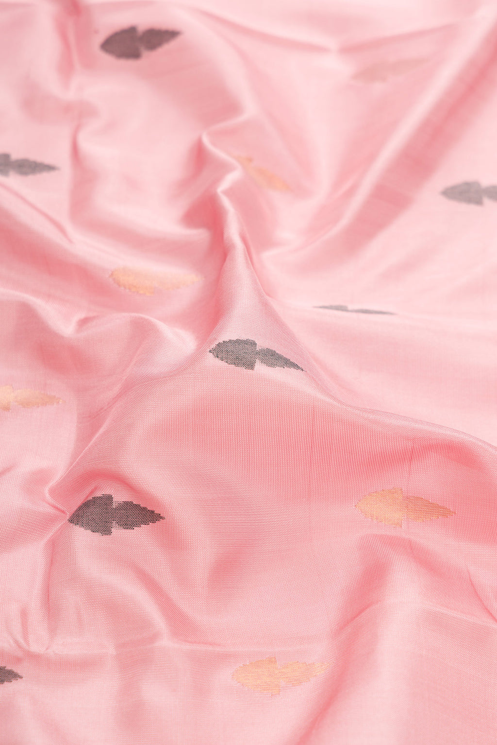 Close up of Pink Dual Tone Uppada Silk Saree with Zari And Thread Butta on the body and Zari Border.  displaying folds