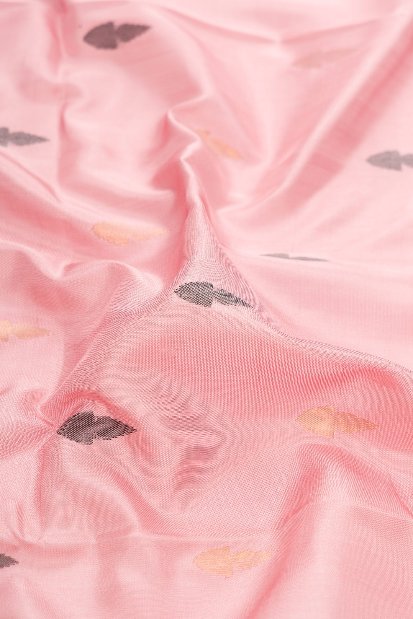 Close up of Pink Dual Tone Uppada Silk Saree with Zari And Thread Butta on the body and Zari Border.  displaying folds