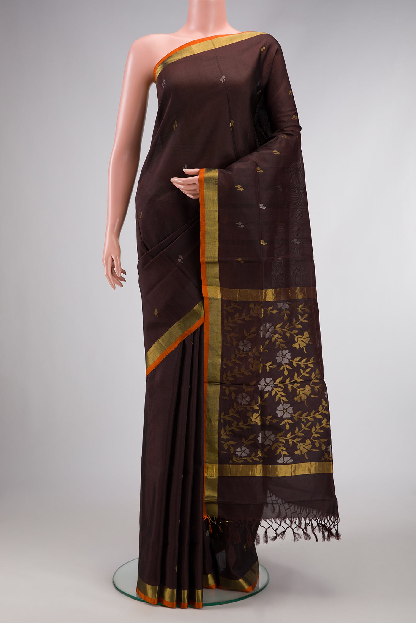 Coffee Brown Dual Tone Uppada Silk Saree with Zari Butta on the body and Zari Border.  displayed on a mannequin
