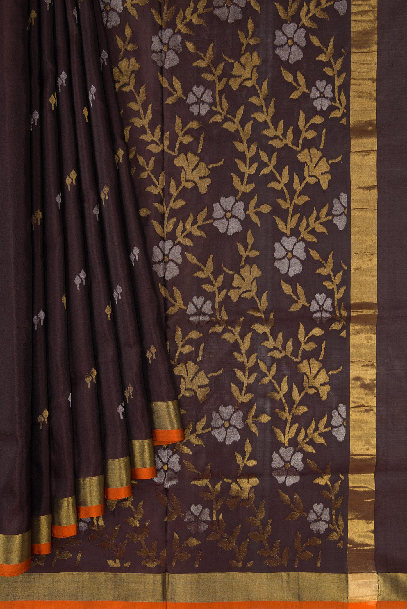 Pleats and pallu of Coffee Brown Dual Tone Uppada Silk Saree with Zari Butta on the body and Zari Border. 