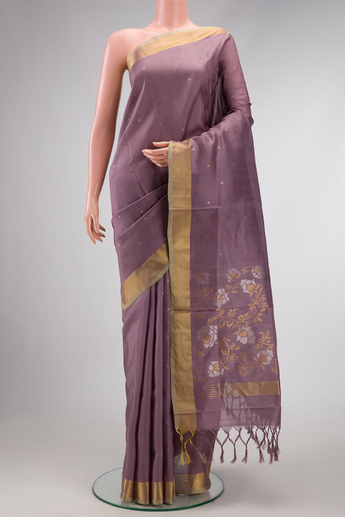 Brown Dual Tone Uppada Silk Saree with Zari Butta on the body and Zari Border.  displayed on a mannequin