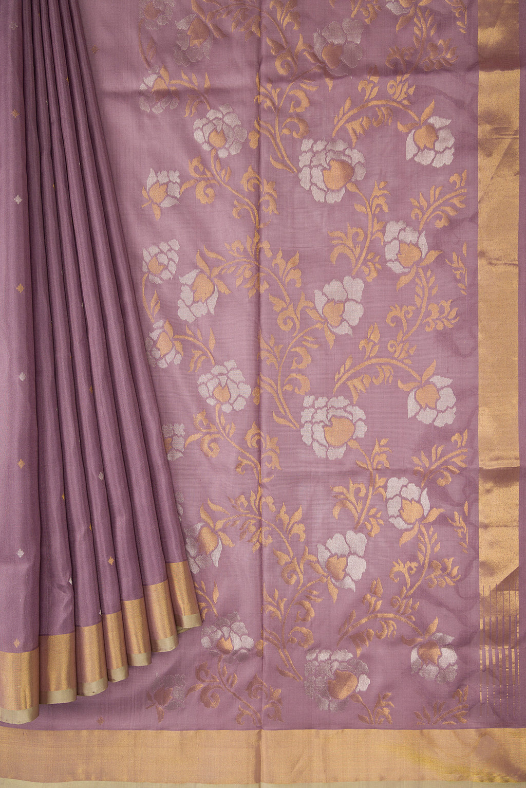 Pleats and pallu of Brown Dual Tone Uppada Silk Saree with Zari Butta on the body and Zari Border. 