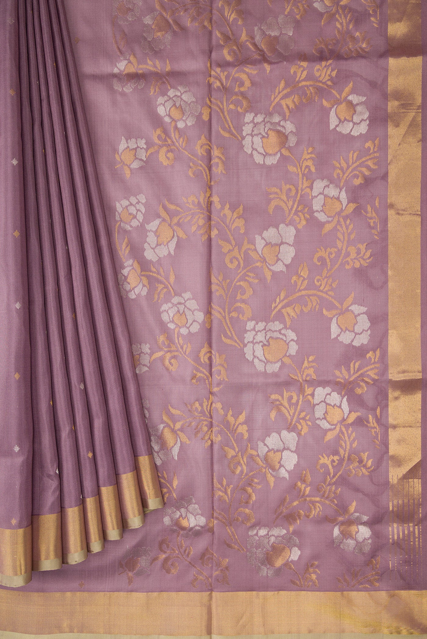 Pleats and pallu of Brown Dual Tone Uppada Silk Saree with Zari Butta on the body and Zari Border. 
