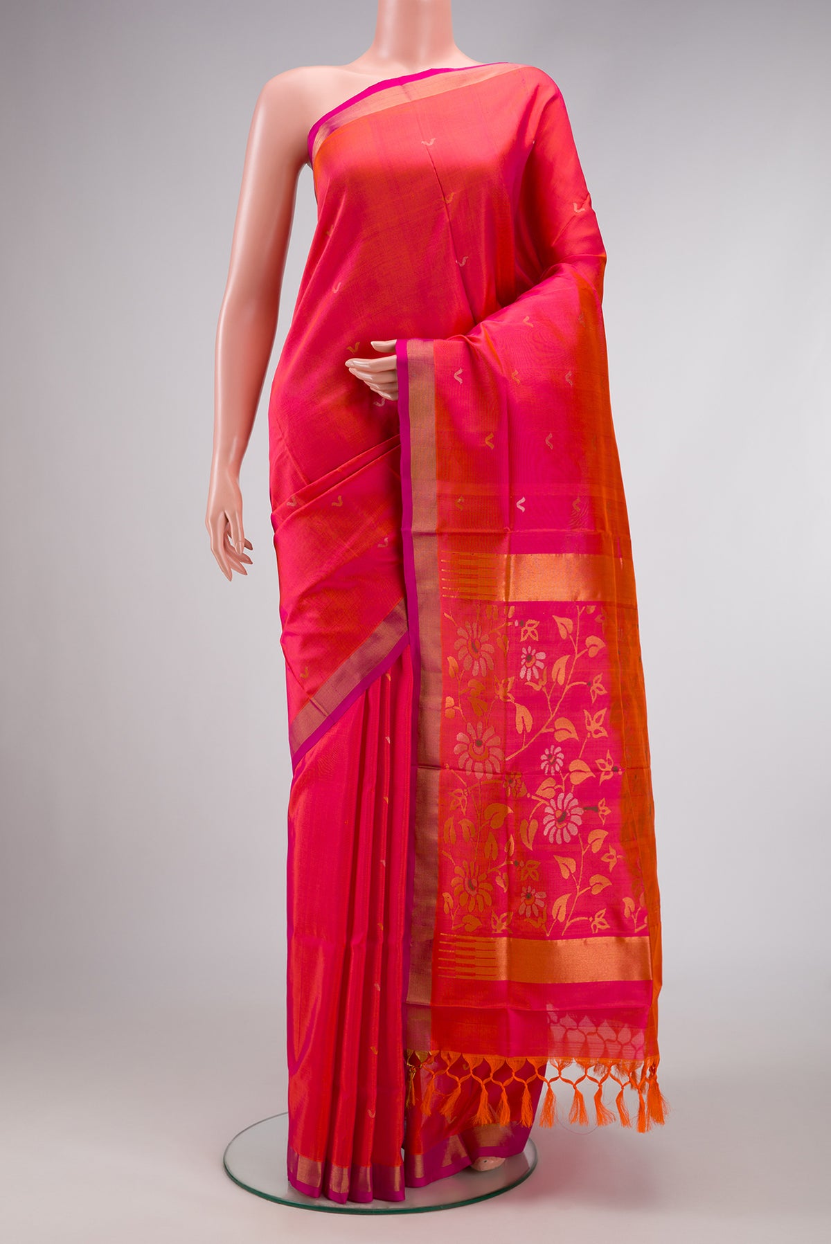 Coral Dual Tone Uppada Silk Saree with Zari Butta on the body and Zari Border.  displayed on a mannequin