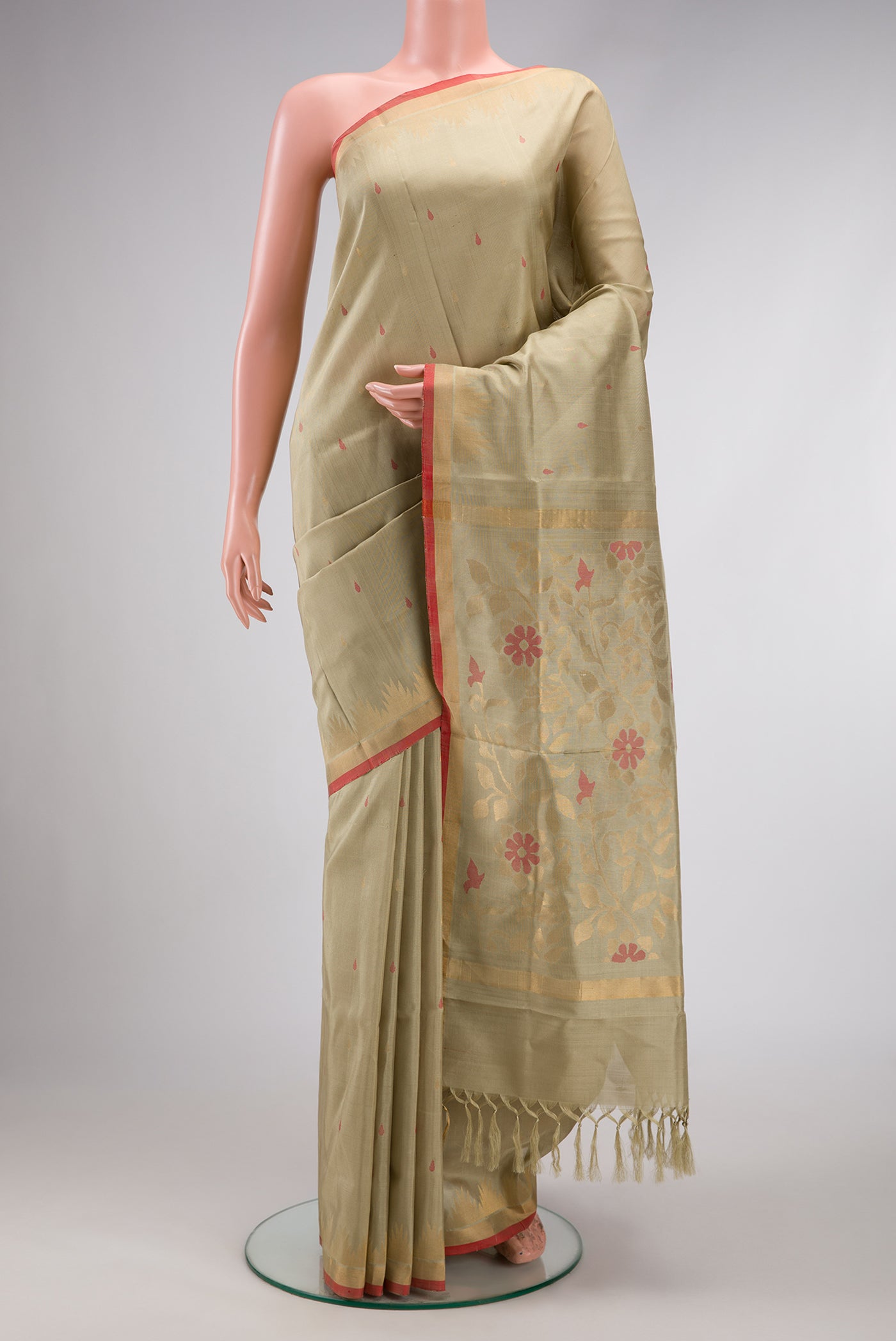 Beige Dual Tone Uppada Silk Saree with Zari And Thread Butta on the body and Temple Border.  displayed on a mannequin