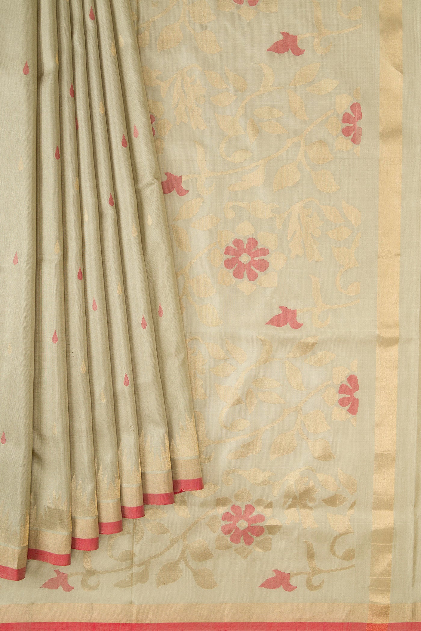Pleats and pallu of Beige Dual Tone Uppada Silk Saree with Zari And Thread Butta on the body and Temple Border. 