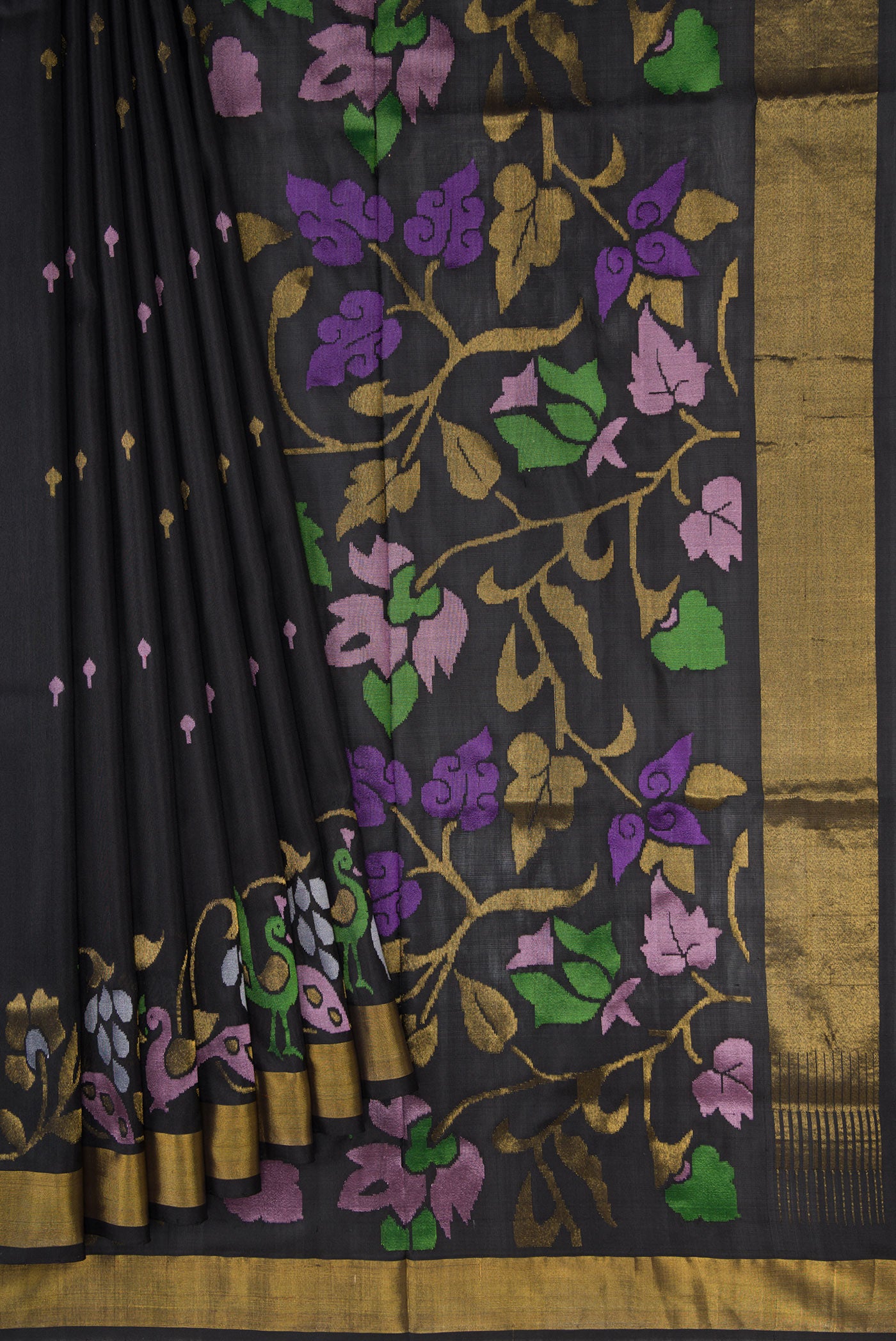Pleats and pallu of Black Dual Tone Uppada Silk Saree with Zari And Thread Butta on the body and Zari Border. 
