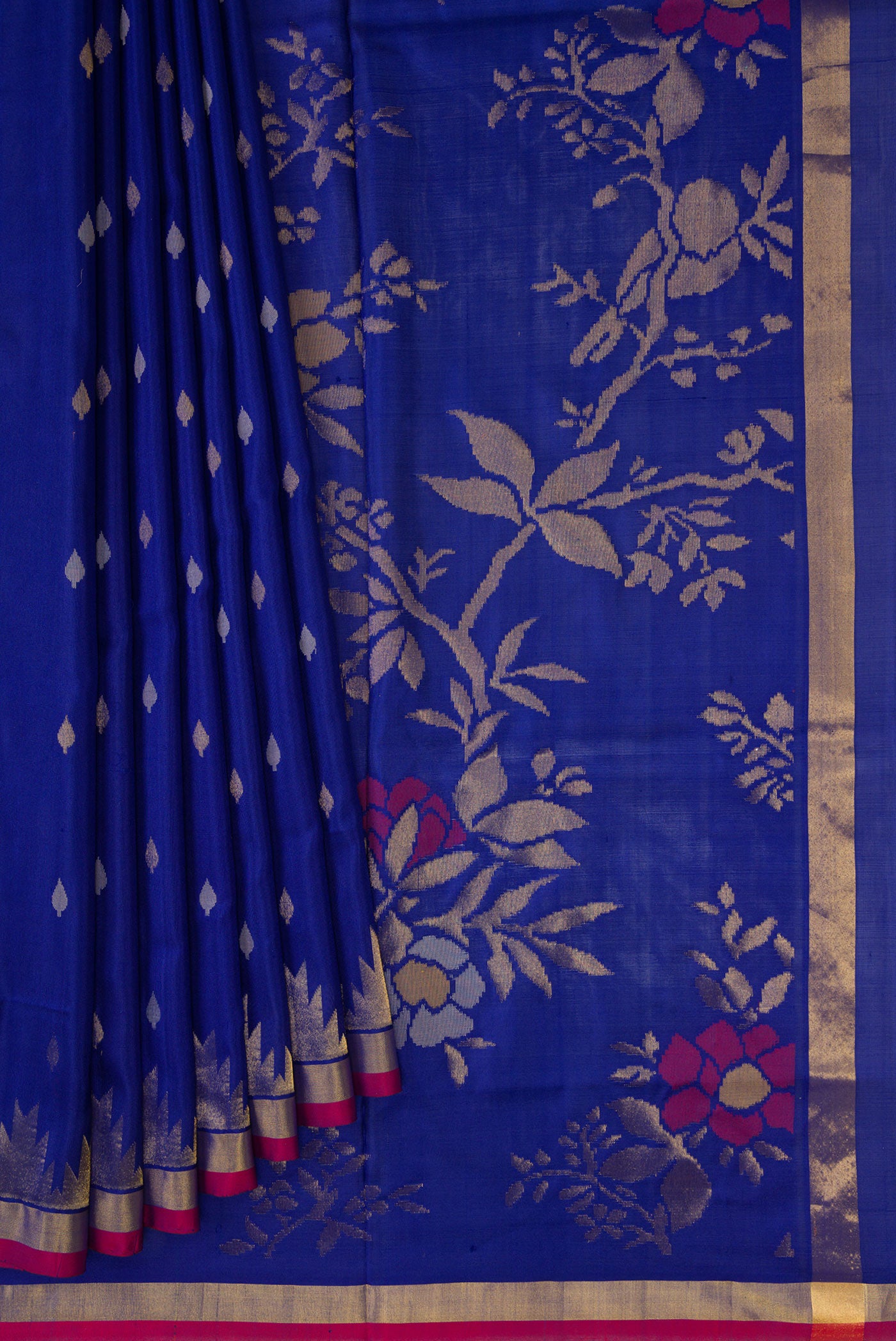 Pleats and pallu of Navy Blue Dual Tone Uppada Silk Saree with Zari Butta on the body and Temple Border. 