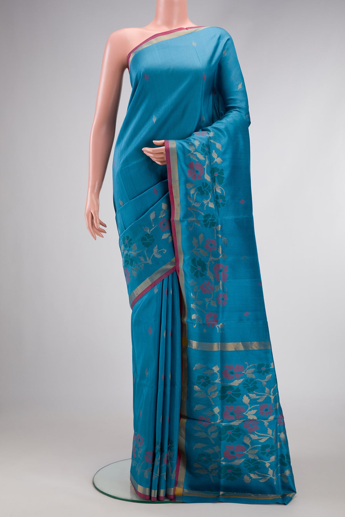 Sky Blue Dual Tone Uppada Silk Saree with Zari And Thread Butta on the body and Fancy Border.  displayed on a mannequin