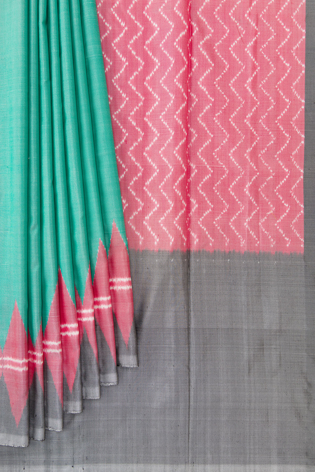 Pleats and pallu of Green Dual Tone Double Ikat Saree with Plain Body and Temple Border. 