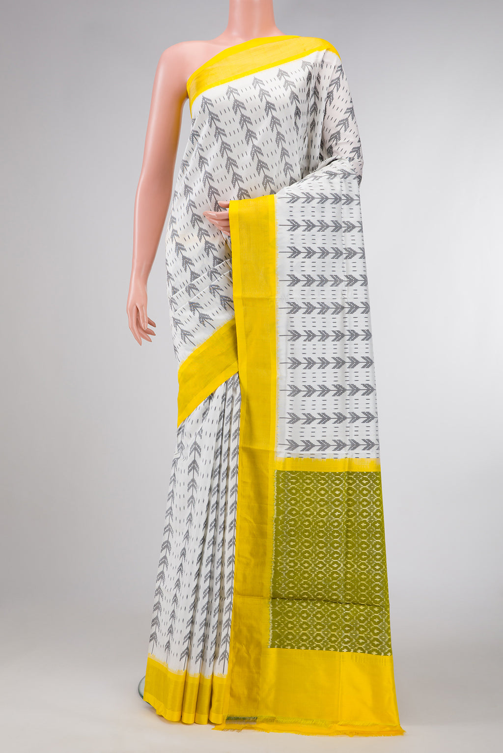 Off White Dual Tone Double Ikat Saree with Ikat Print on the body and Zari Border.  displayed on a mannequin